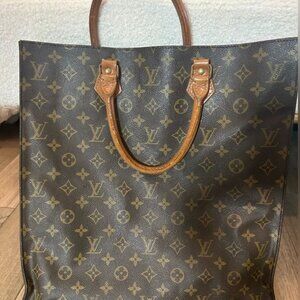 Pre owned Louis Vuitton bag, perfect for laptop. Used & loved w signs of wear.